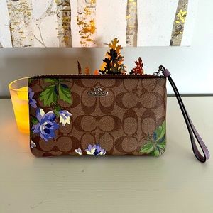 Coach wristlet with vintage purple flower pattern